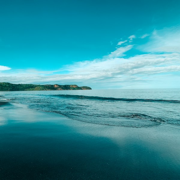 blue sea under blue sky during daytime